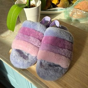 UGG brand size 8 slip on purple slippers that are perfect for cozy mornings